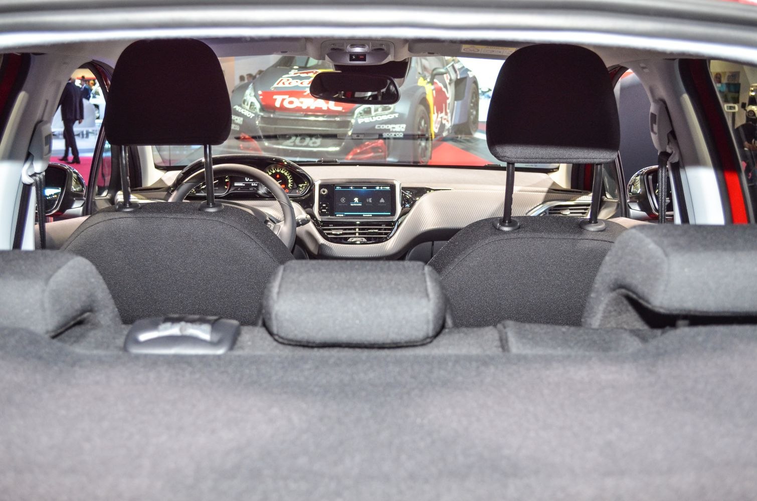 Dashboard with infotainment and rear seats with headrests