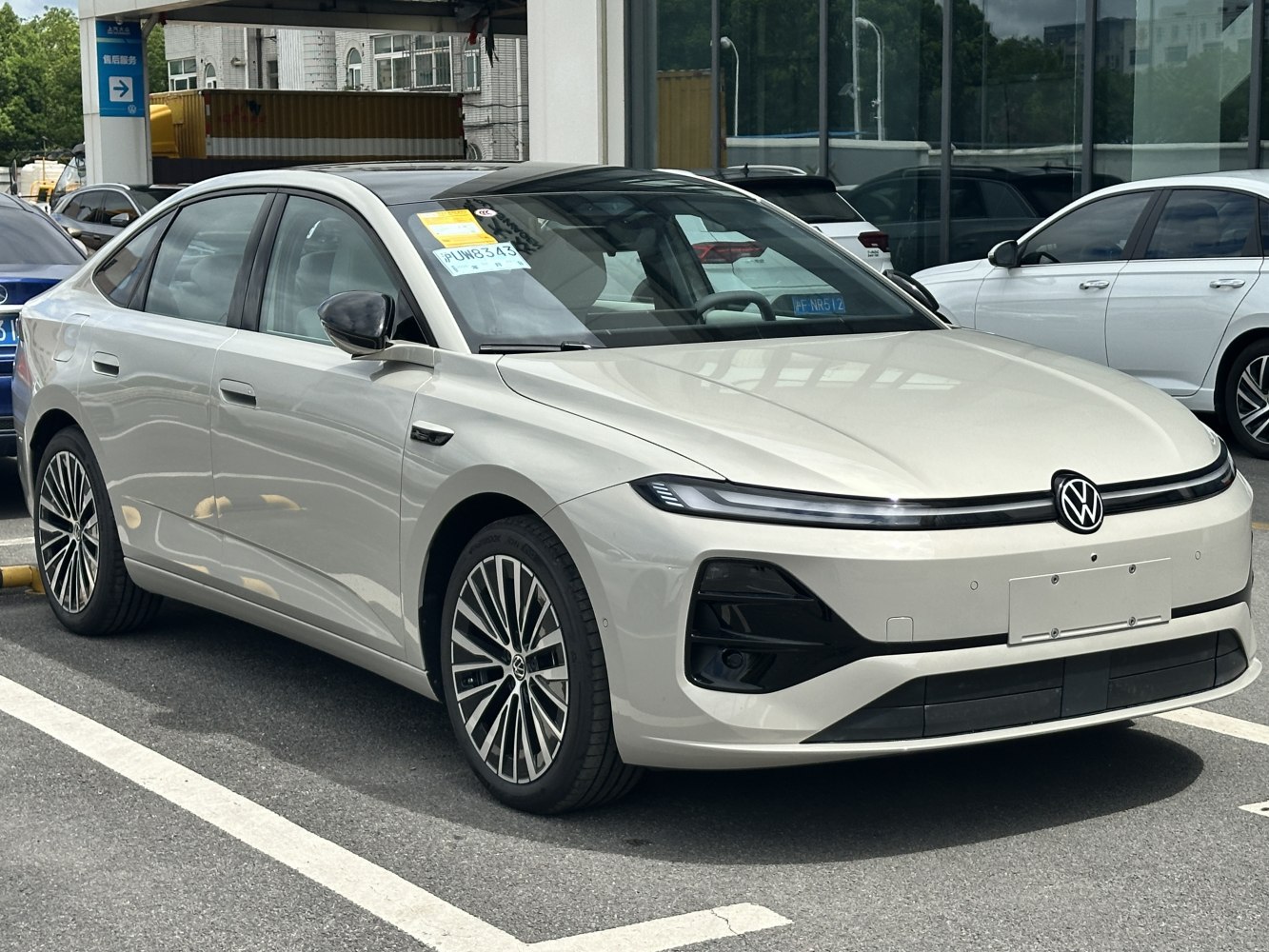 Electric sedan with LED light bar and aerodynamic design