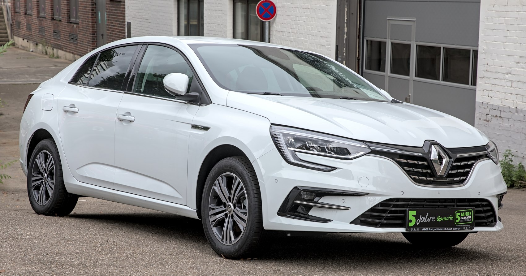 Front and side profile with sleek headlights and aerodynamic sedan design