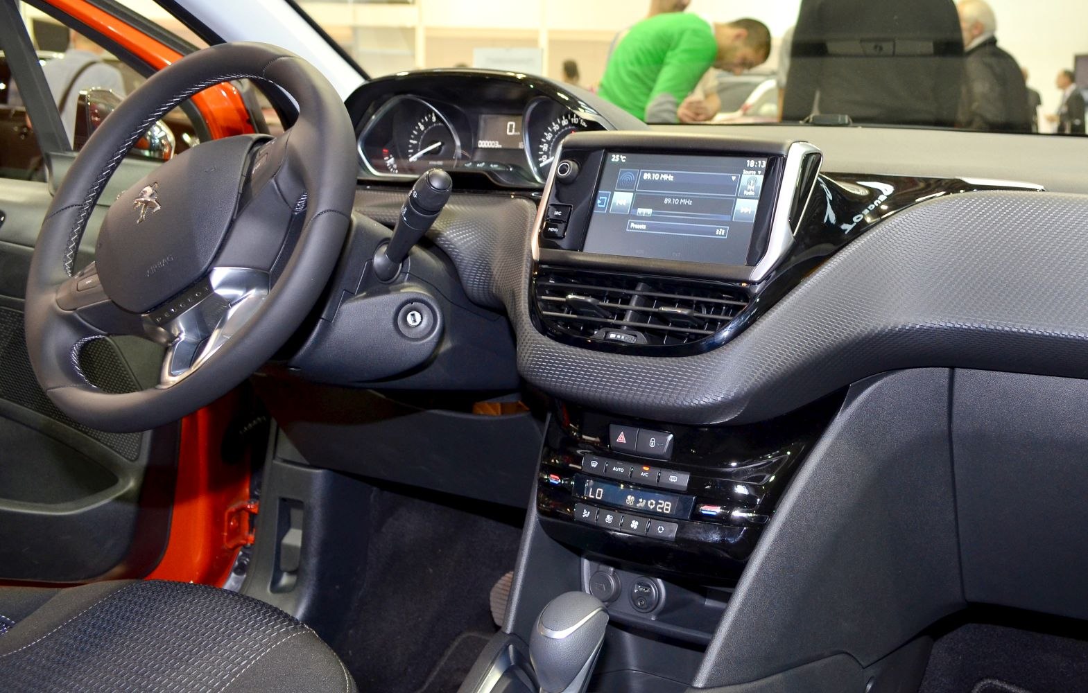 Dashboard with digital display and steering wheel with integrated controls