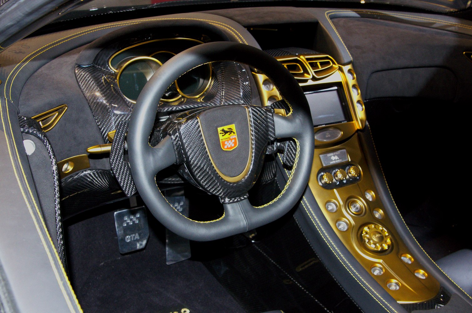 Carbon fiber steering wheel with gold-accented center console