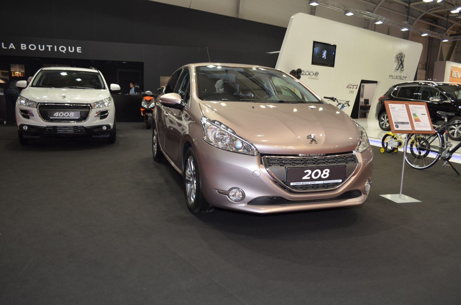 Close-up front view of a hatchback with distinct headlights and grille
