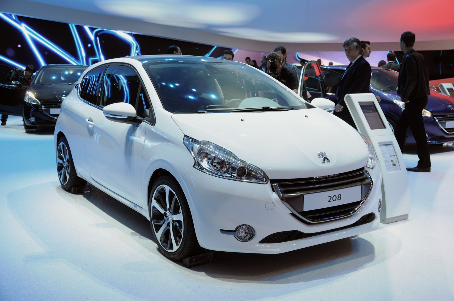 Front view of hatchback with distinctive headlights and alloy wheels