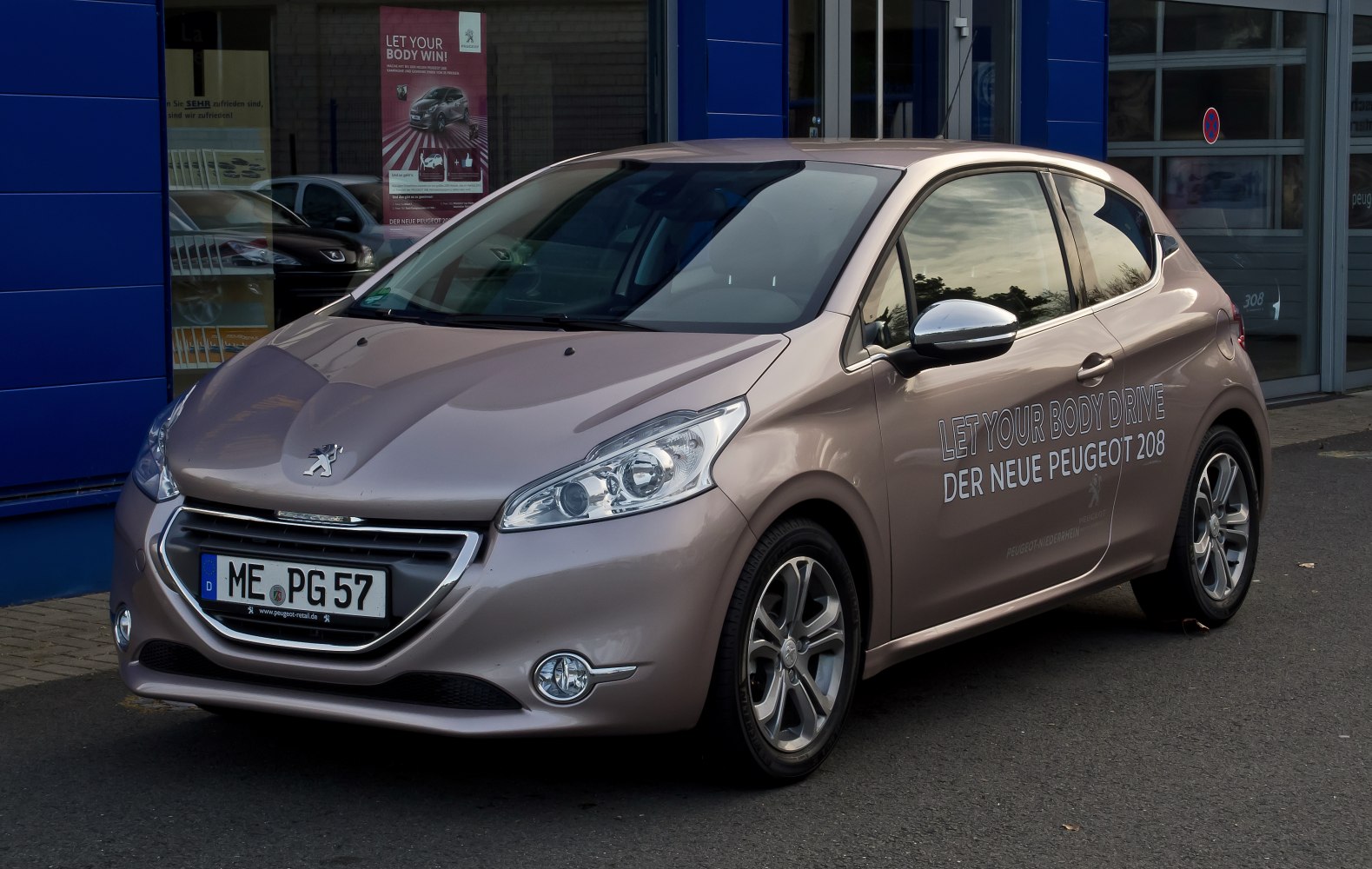 Front three-quarter view of compact hatchback with modern headlights