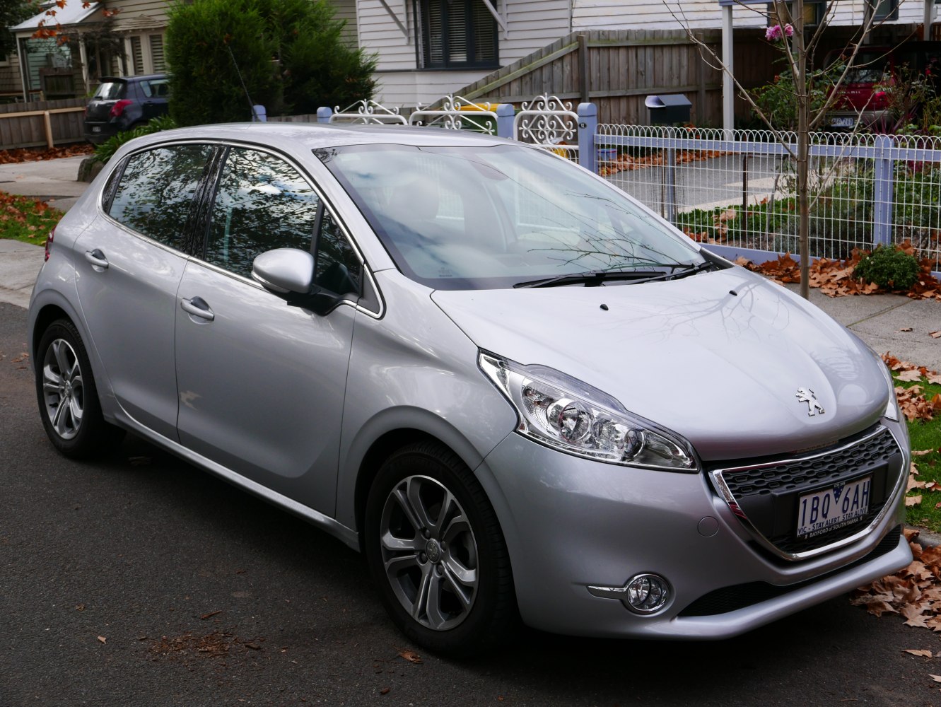 Silver modern compact hatchback with sleek headlights and distinctive grille