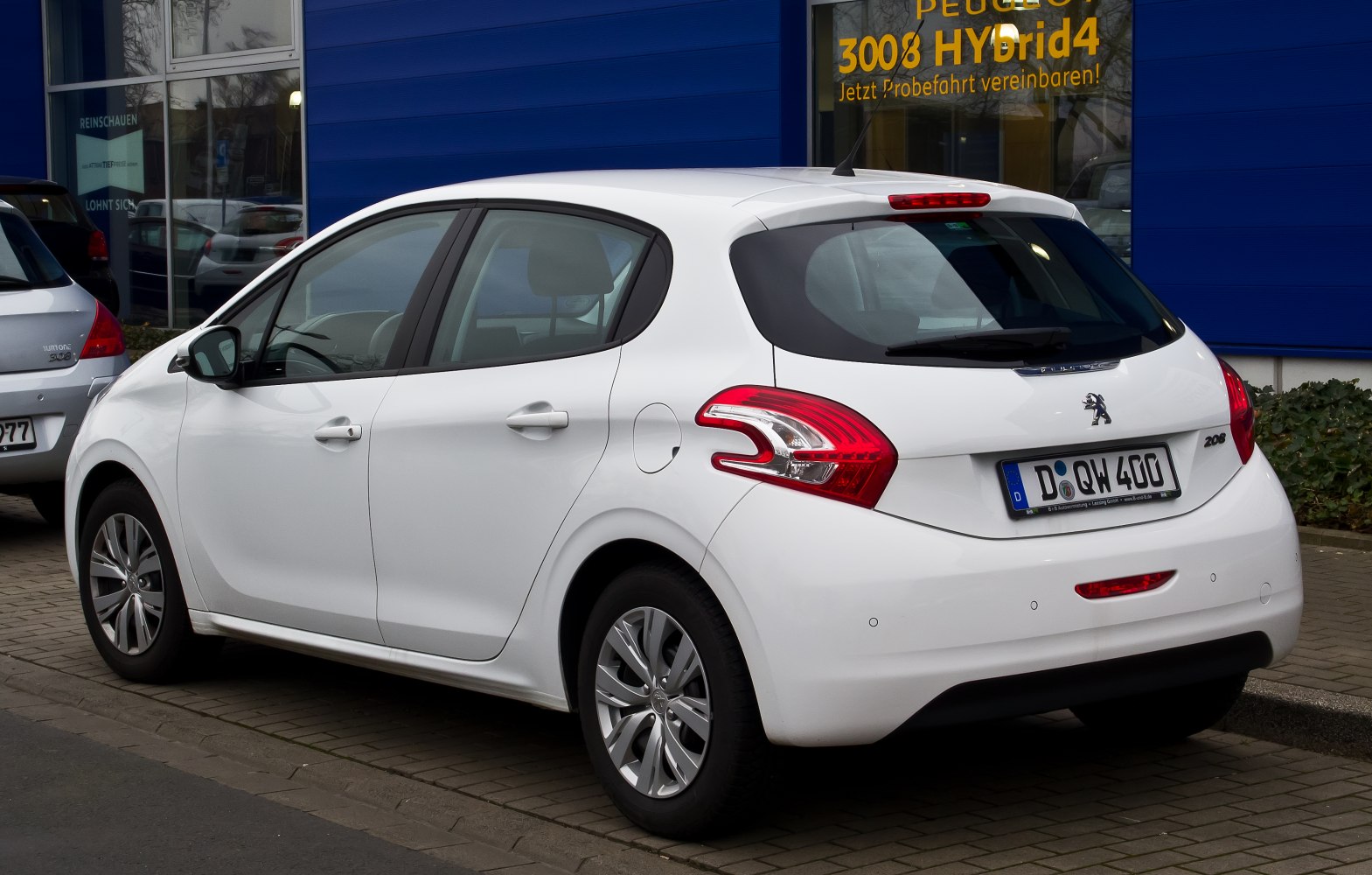 Rear side view of hatchback with distinctive Peugeot tail lights