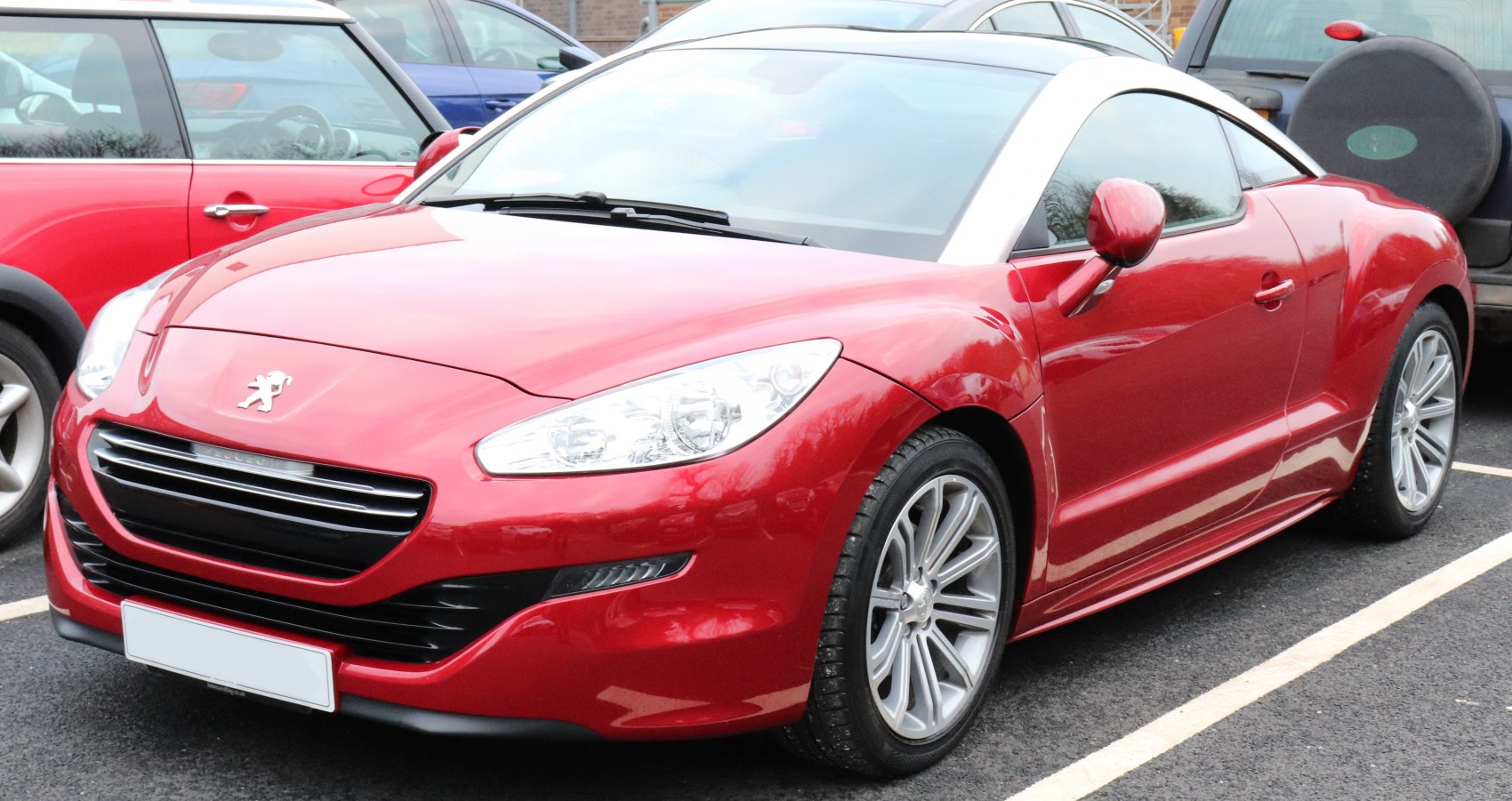 Sporty coupe front grille and sleek side profile with alloy wheels