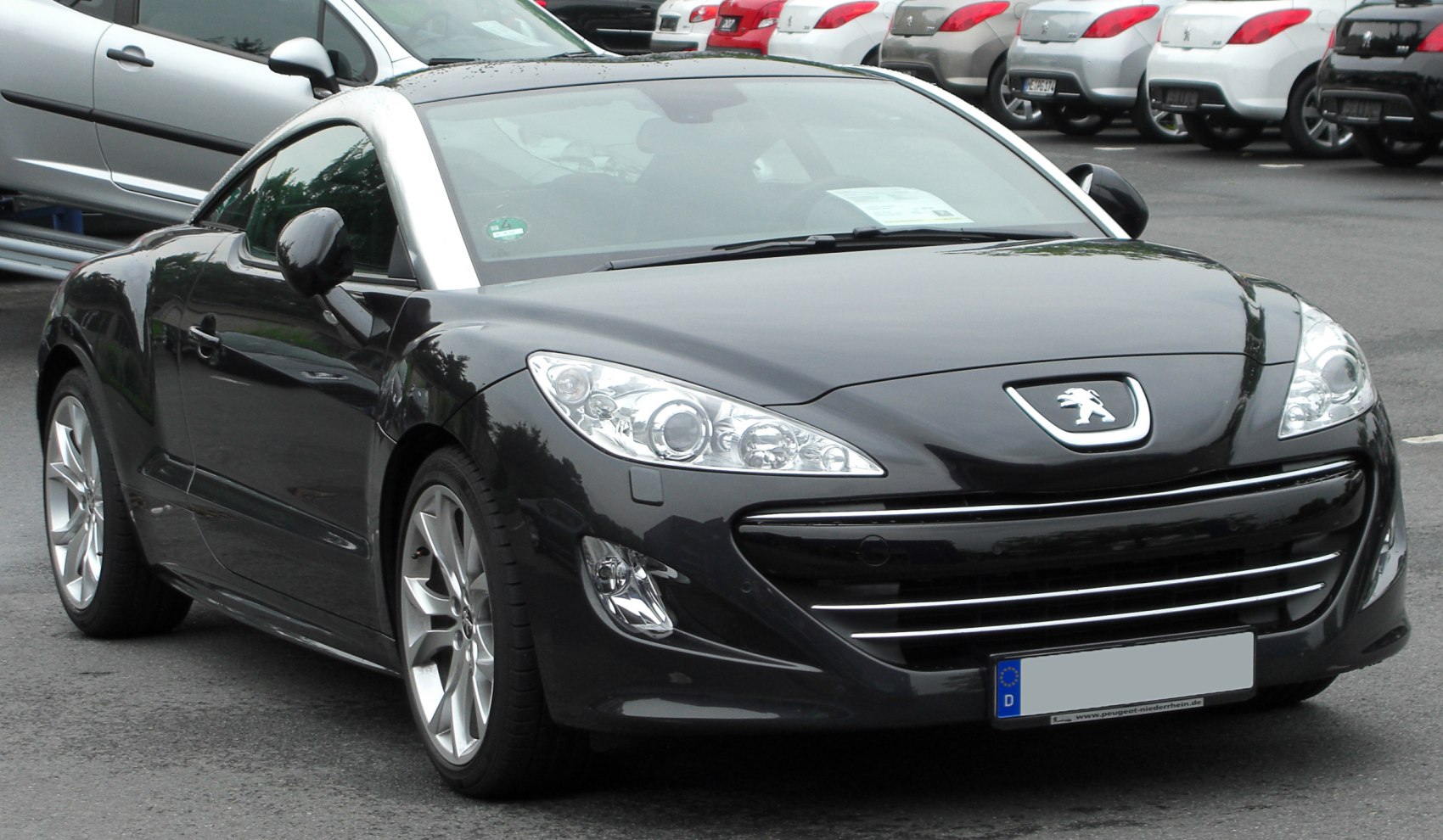Sporty coupe with iconic chrome roof and sharp headlight design