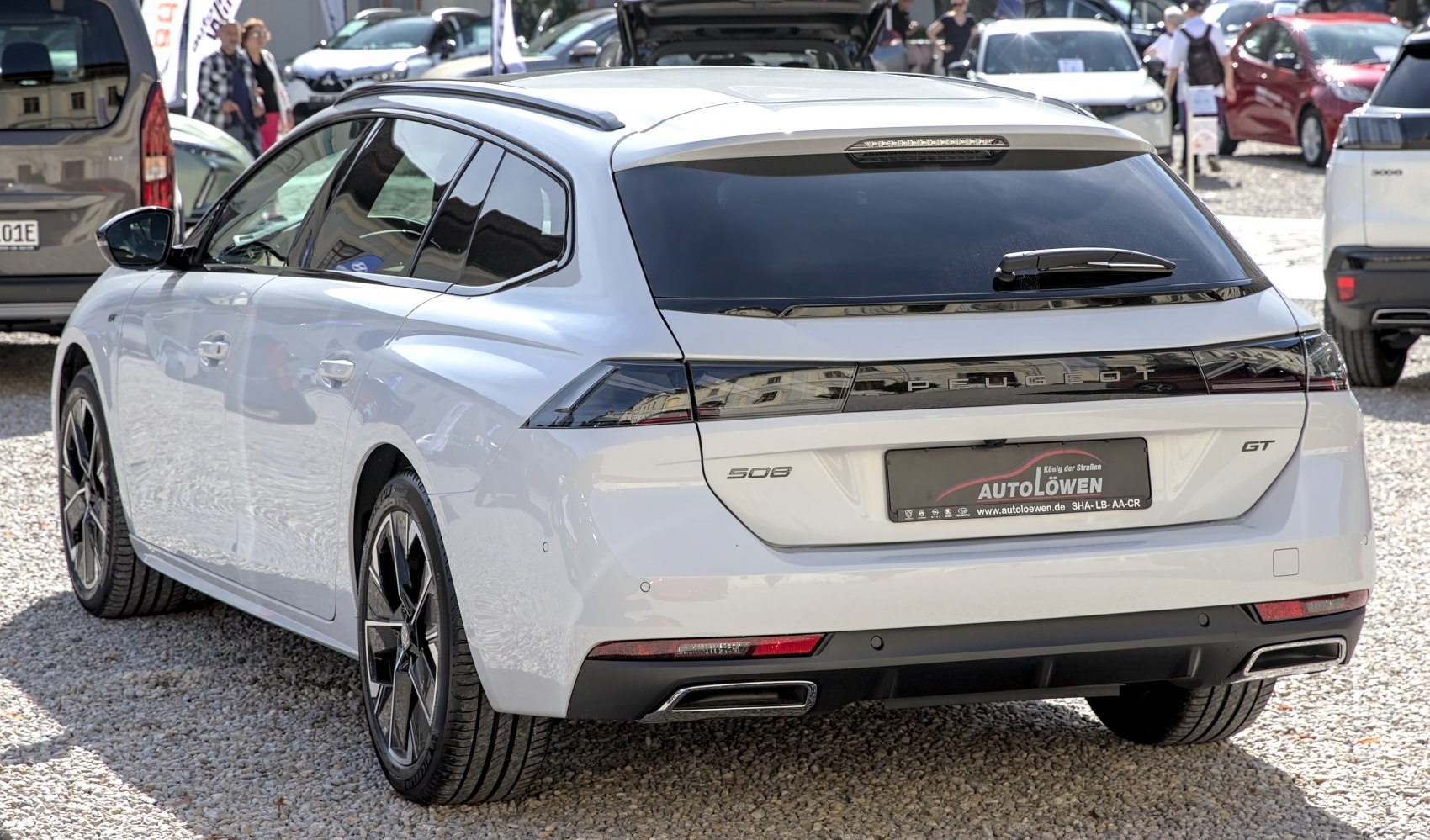 Rear view of a modern station wagon with sleek taillights and alloy wheels