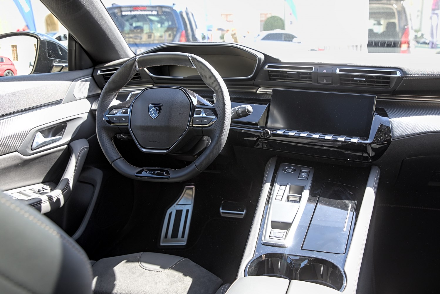 Modern dashboard and sporty steering wheel with digital display and control buttons
