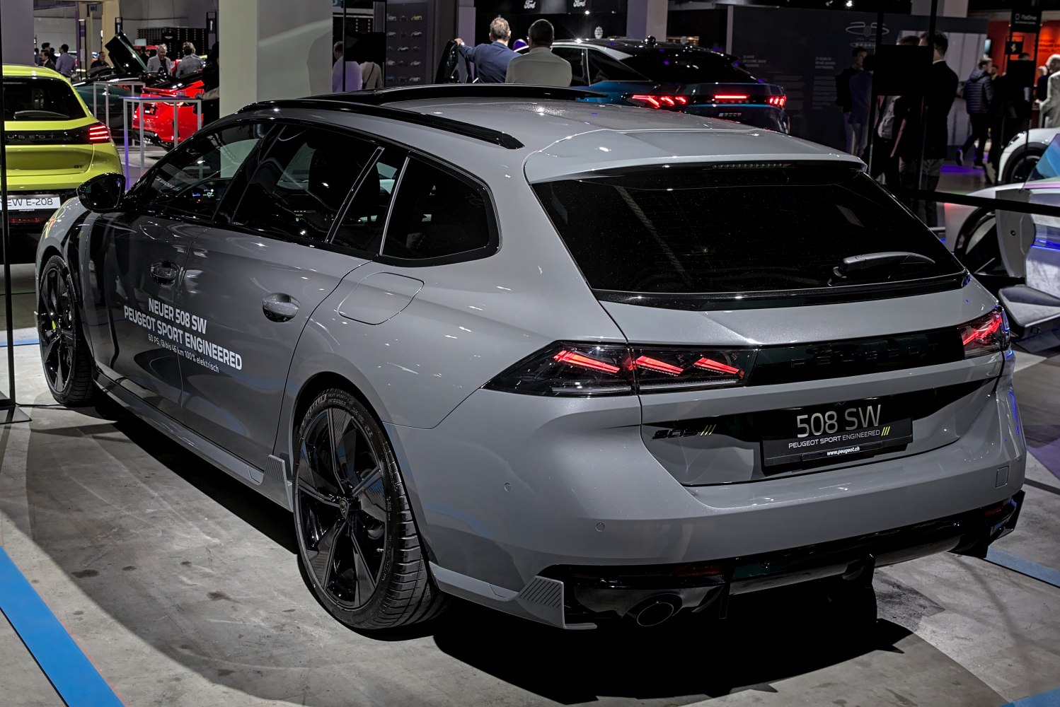 Sporty rear and side view of a metallic station wagon with distinct taillights and sport wheels