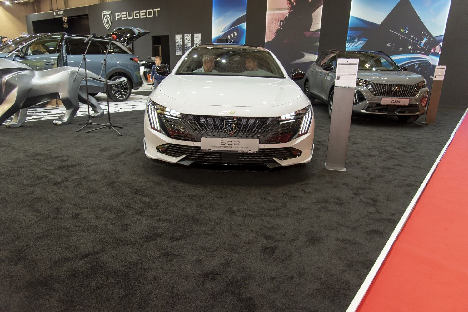 Modern sedan front featuring distinctive grille and LED headlights