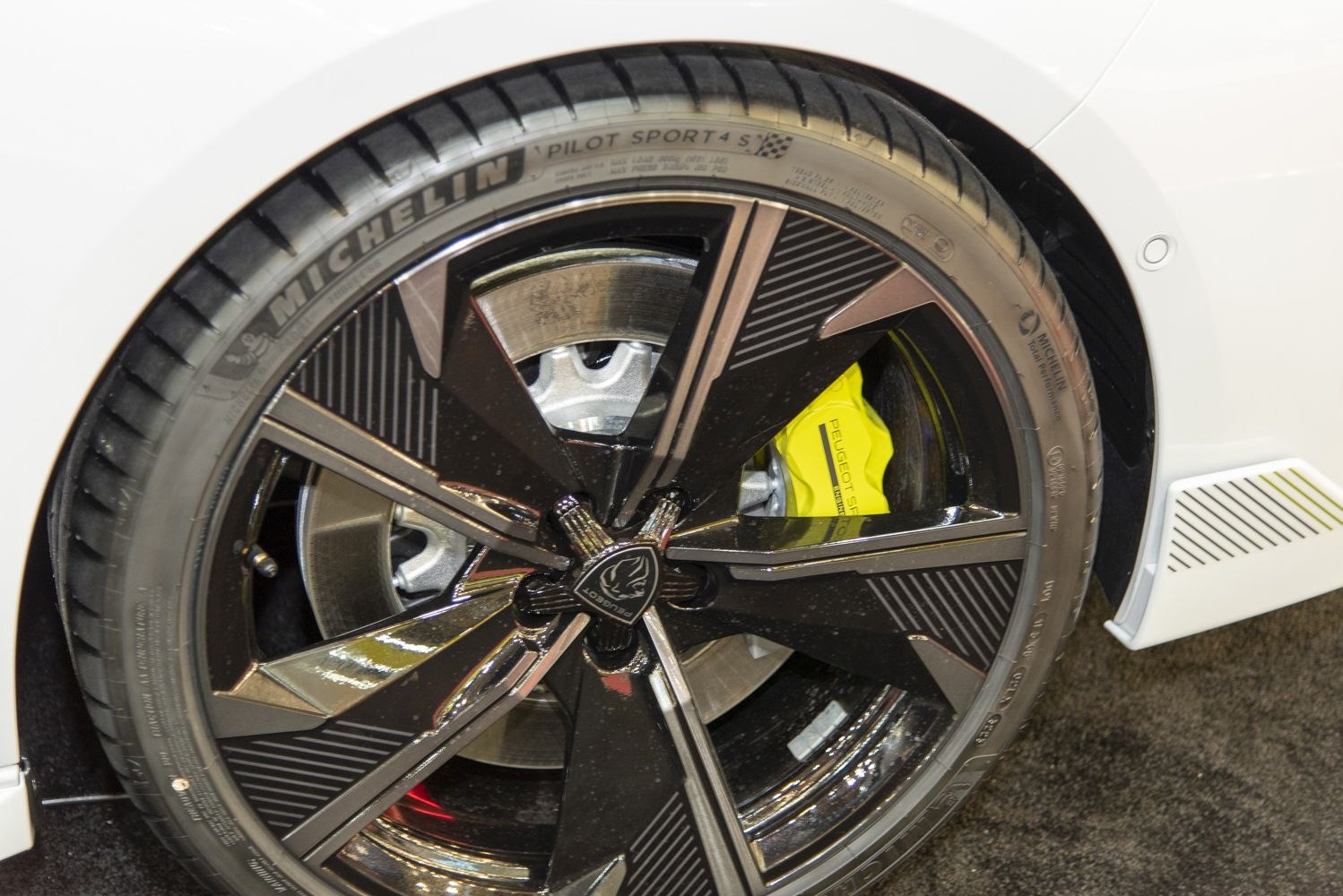 Alloy wheel with yellow brake caliper and Michelin tire