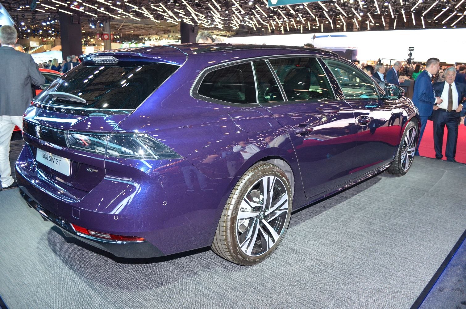 Rear and side profile of an estate car with sporty alloy wheels and sleek tail lights