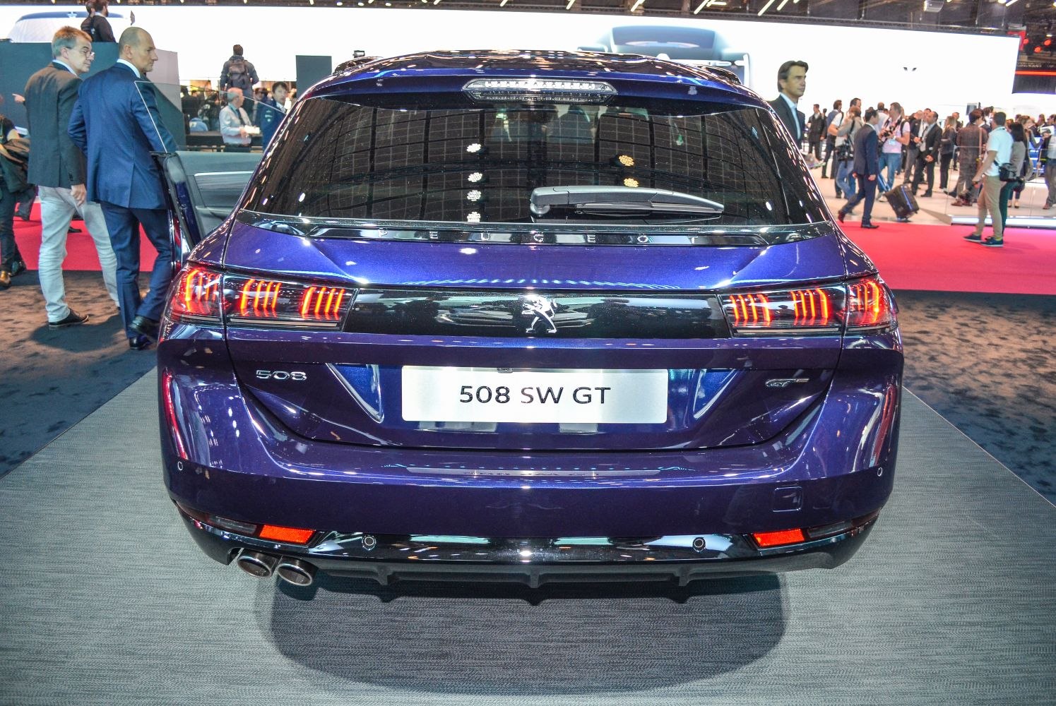 Rear view of estate with distinctive taillights and dual exhaust pipes