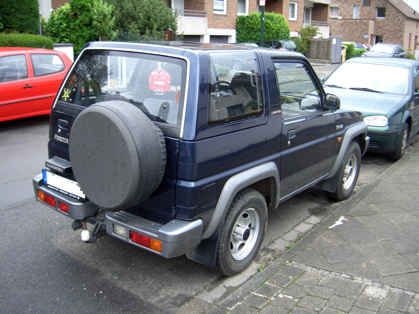 Compact SUV rear side with spare tire cover and rear lights