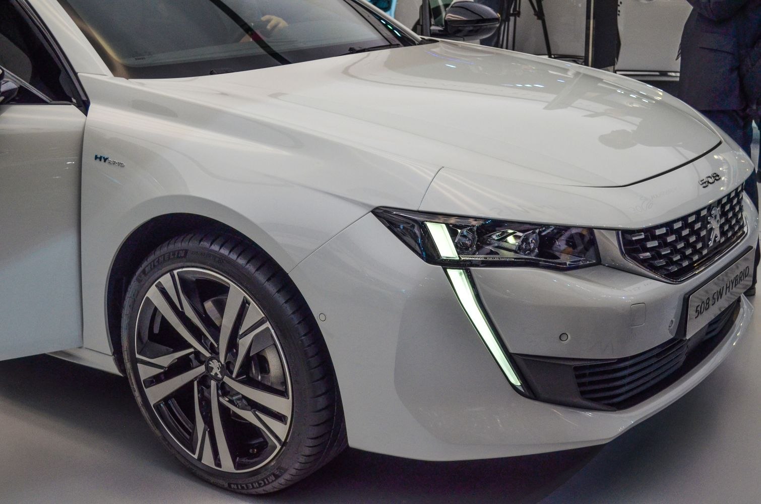 Front LED headlights and alloy wheel design close-up