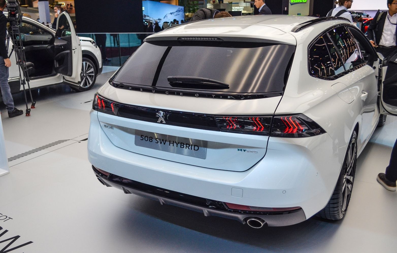 Hybrid station wagon rear view with distinctive tail lights and dual exhausts
