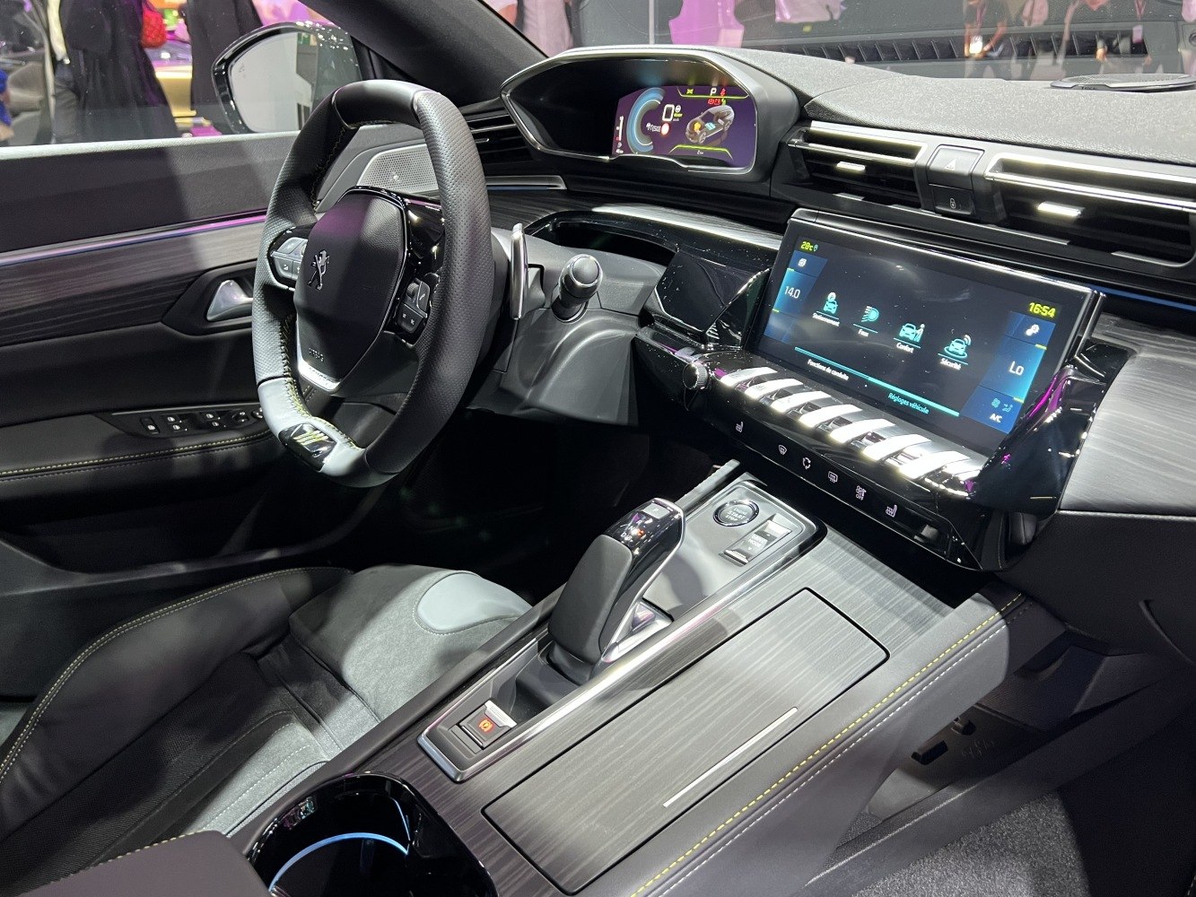Digital dashboard and infotainment display with steering wheel controls in sleek modern cockpit