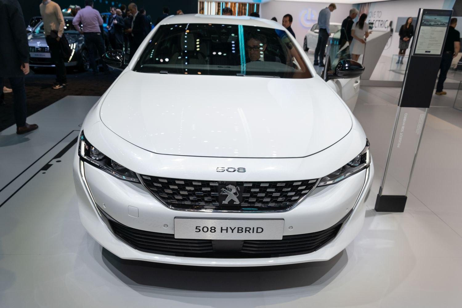 Front view showing LED headlights and grille of a modern hybrid.
