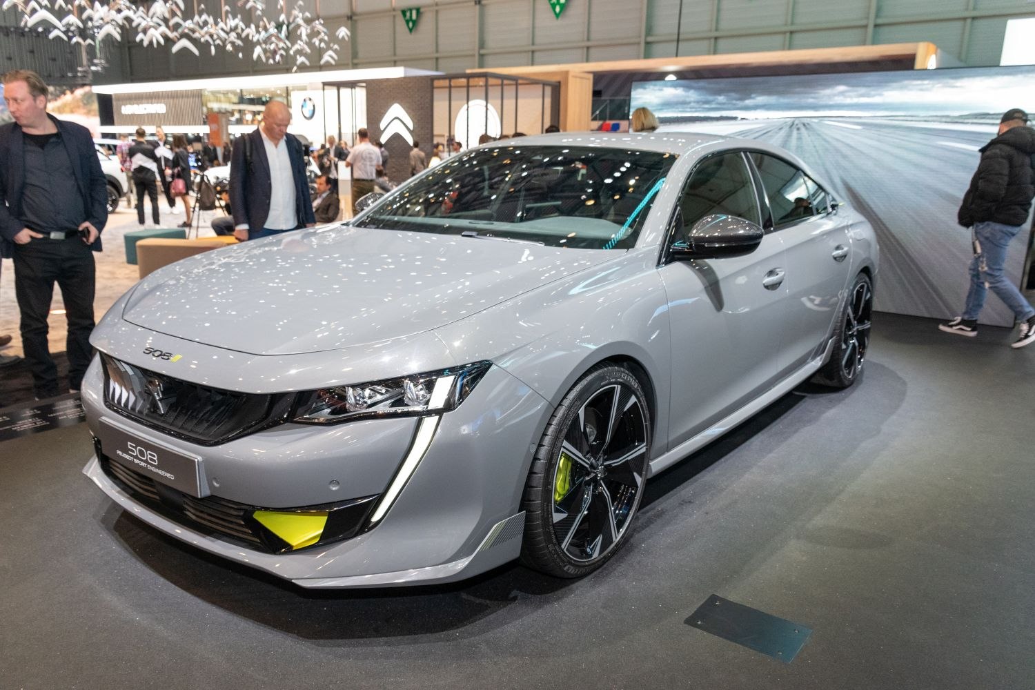 Sharp LED headlights and sporty alloy wheels on modern sedan front.