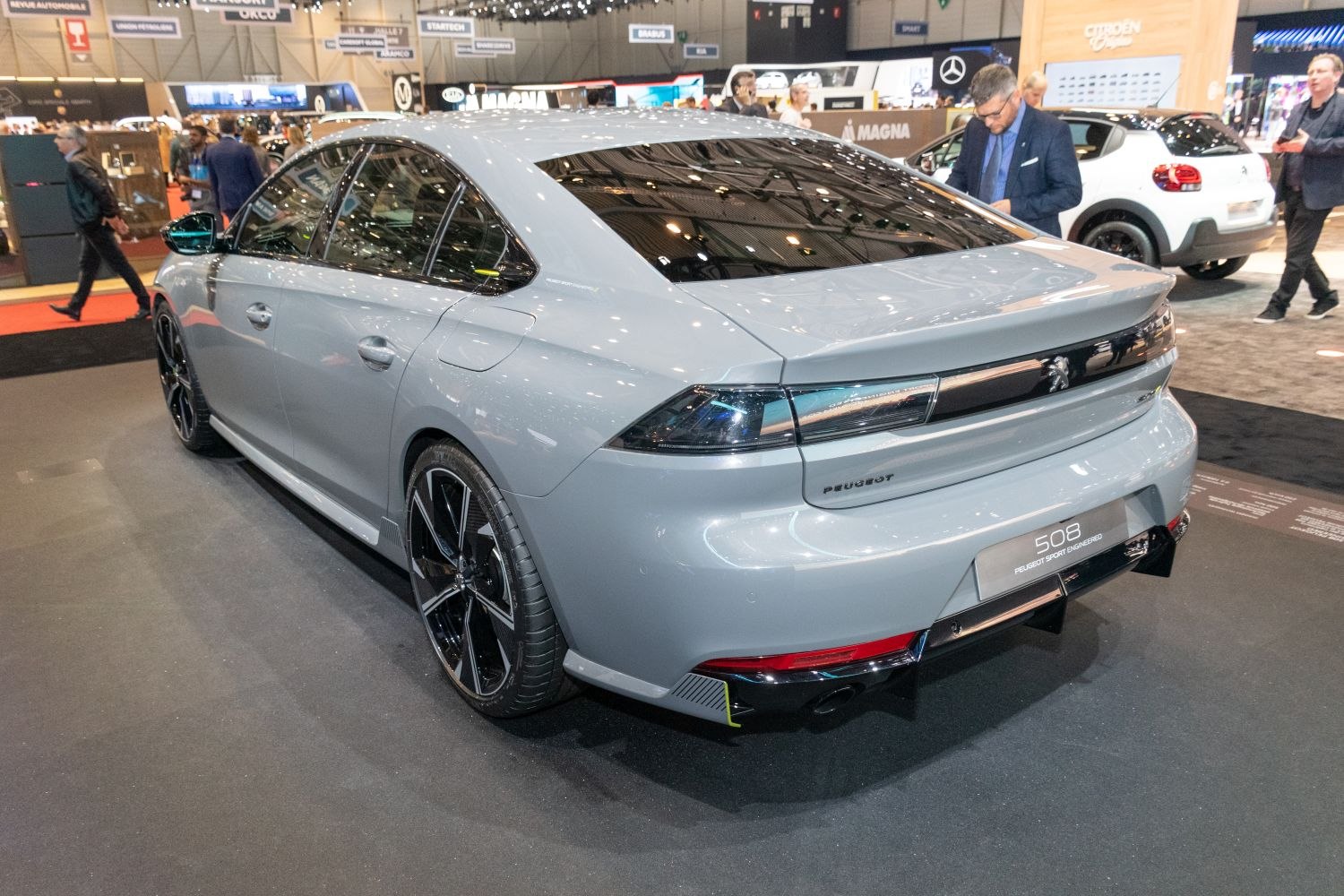 Sleek rear and side view with tinted windows and black alloy wheels