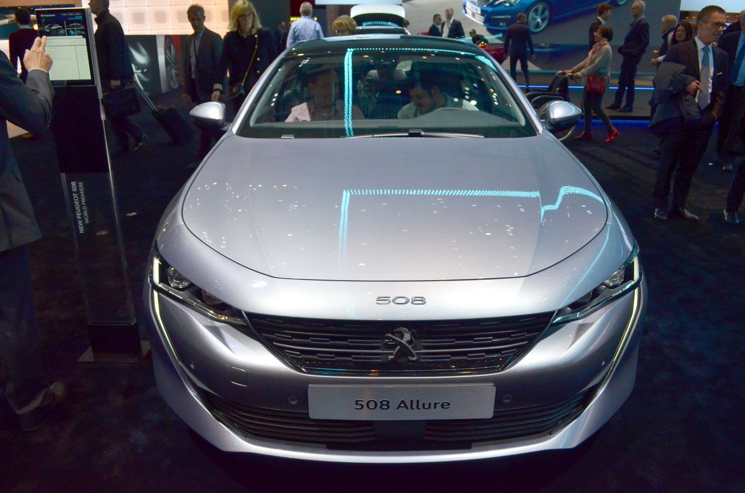 Front view of silver hatchback with distinct grille and LED headlights