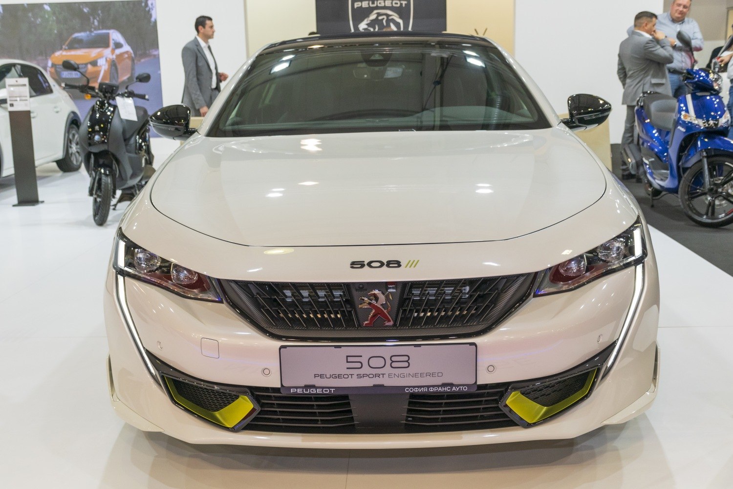 Aggressive front grille, sleek headlights, yellow sport accents