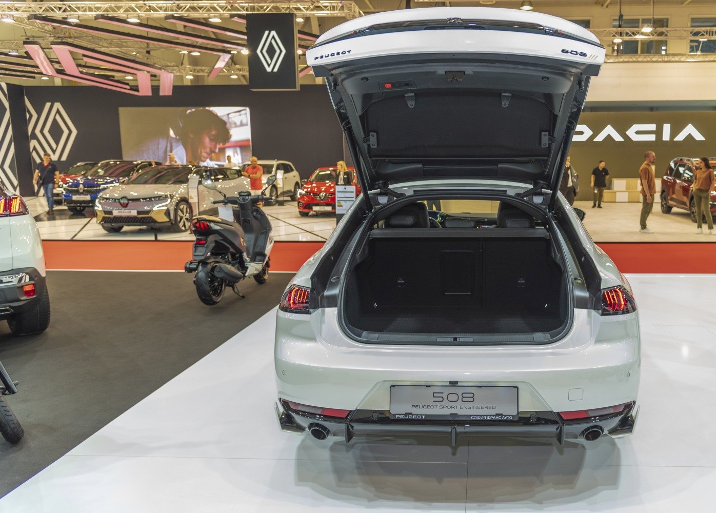 Open trunk of a modern hatchback showing spacious cargo area and rear lights
