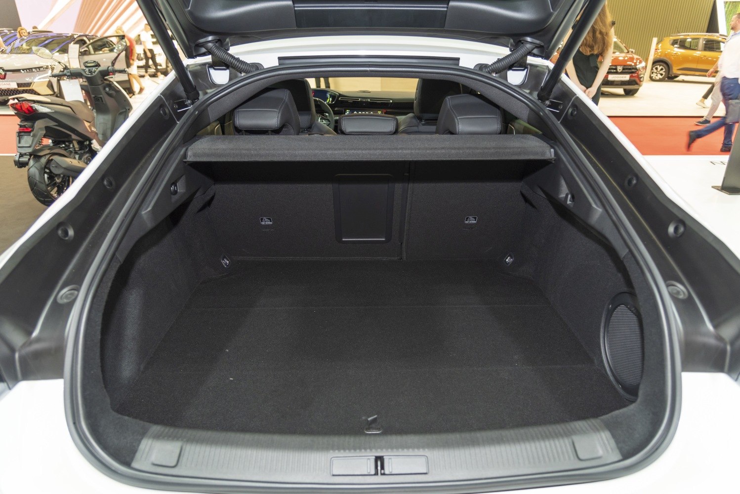 Spacious rear trunk interior with black upholstery and pass-through