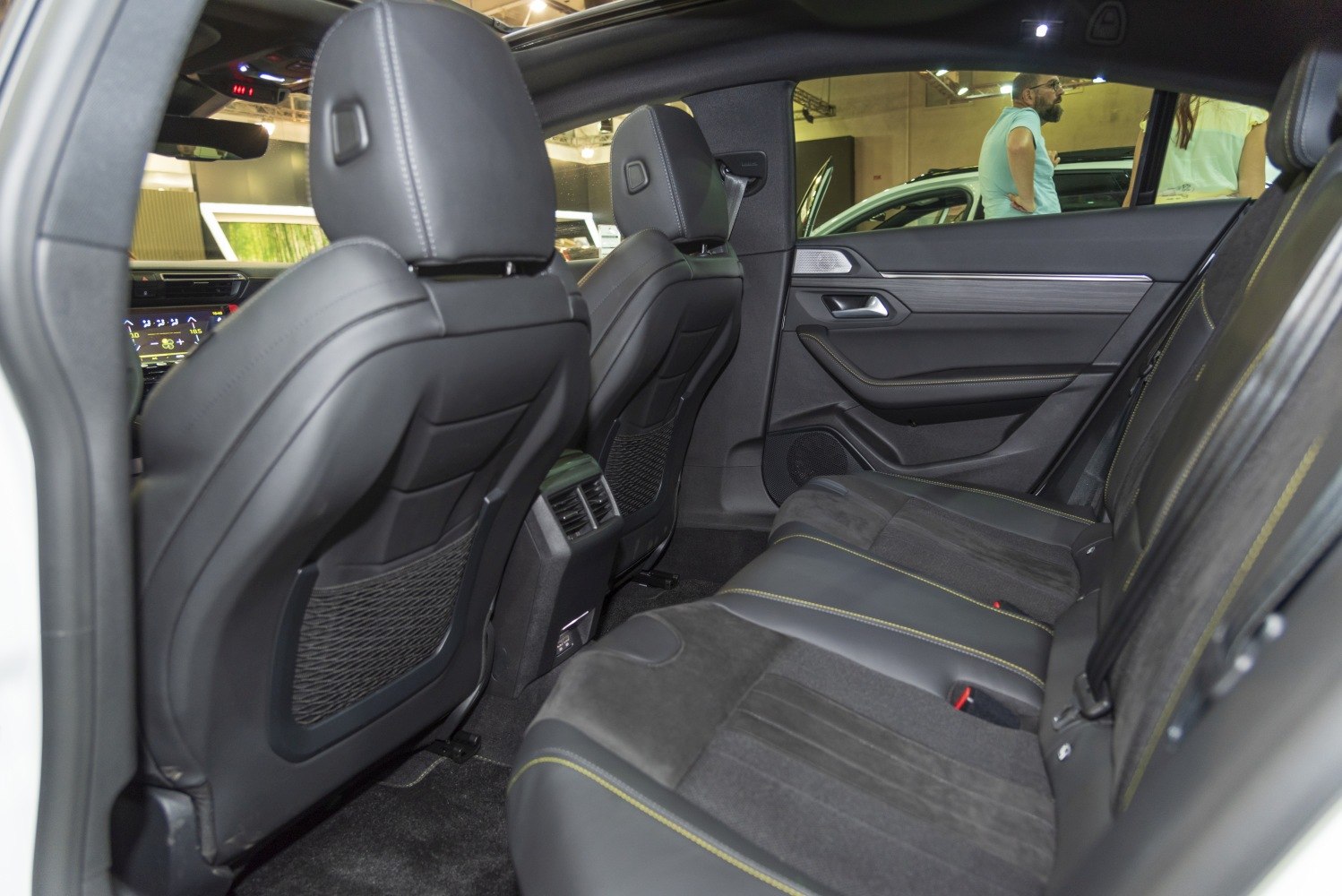 Rear seat interior with leather upholstery and door panel details
