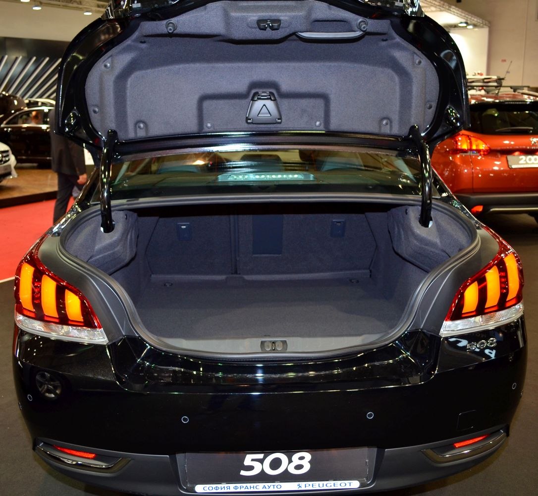 Open trunk with spacious, carpet-lined luggage compartment