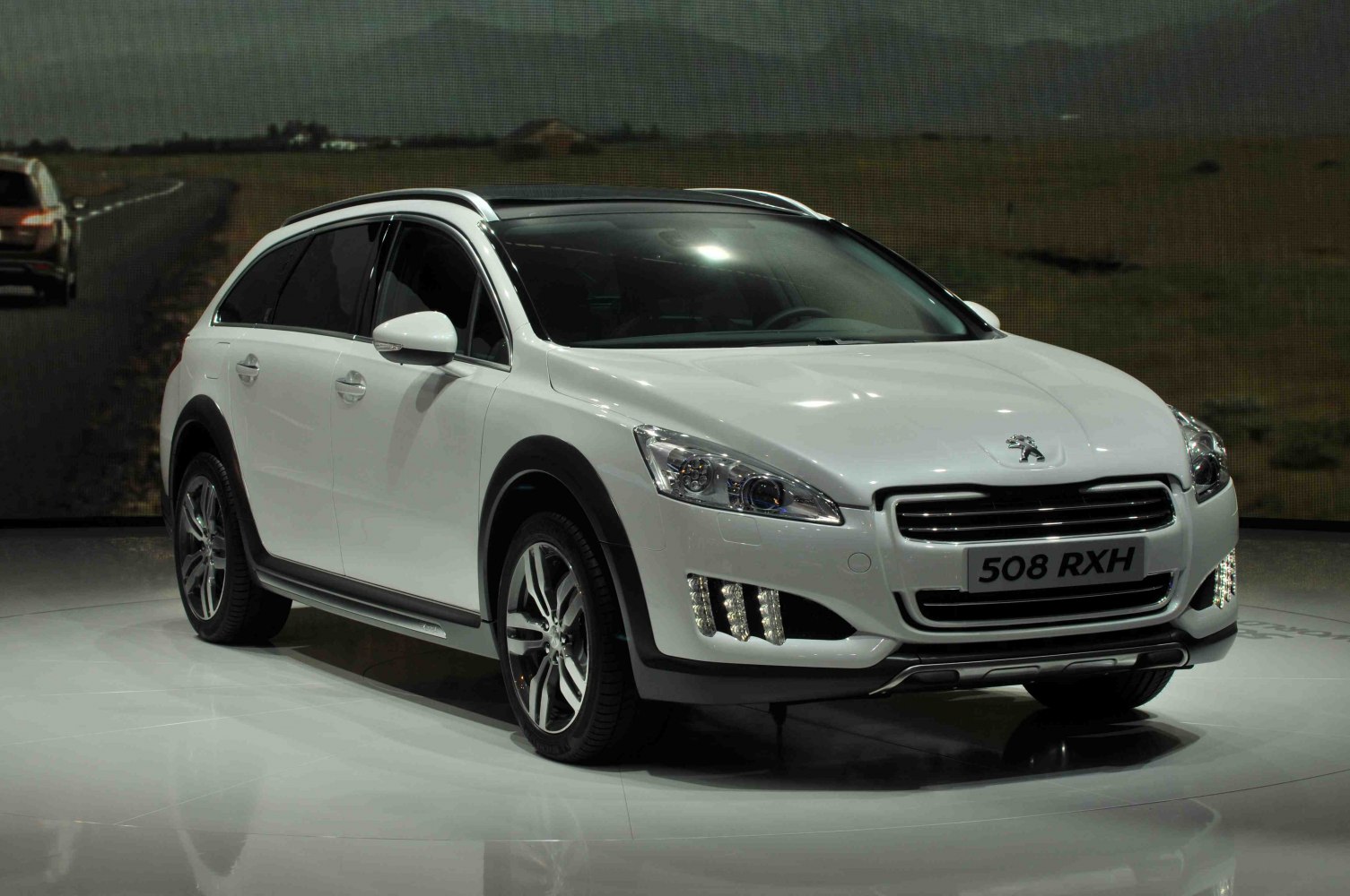Front side view with LED daytime running lights and rugged body cladding