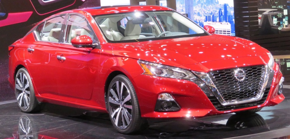 Front-side view with LED headlights and distinctive chrome grille