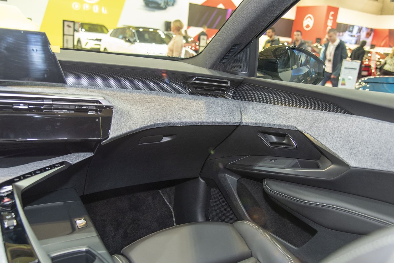 Modern car dashboard and door panel with fabric and sleek design
