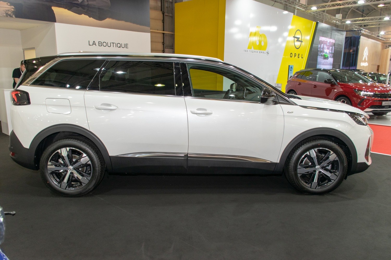 Side profile of an SUV with alloy wheels and tinted windows