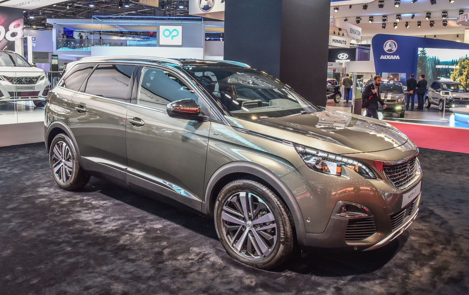 SUV front-side view with modern headlights and alloy wheels