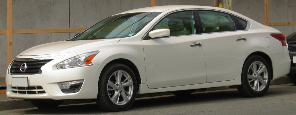 Side profile with distinctive headlights and alloy wheels