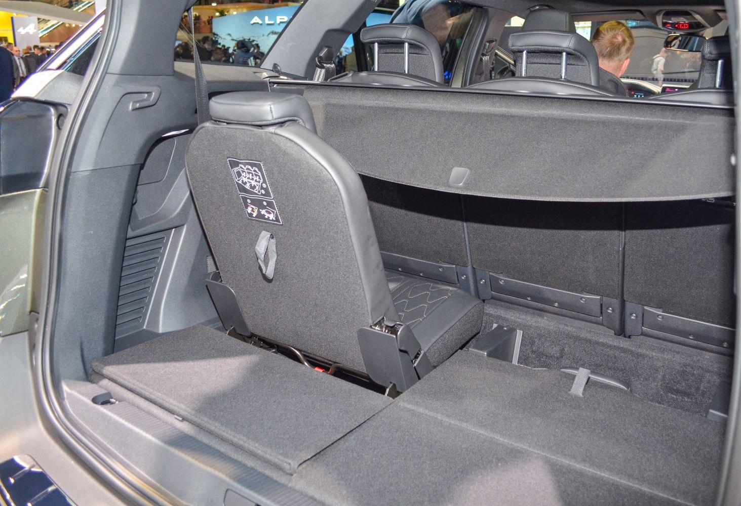 Spacious rear cargo area with partially folded third-row seats.