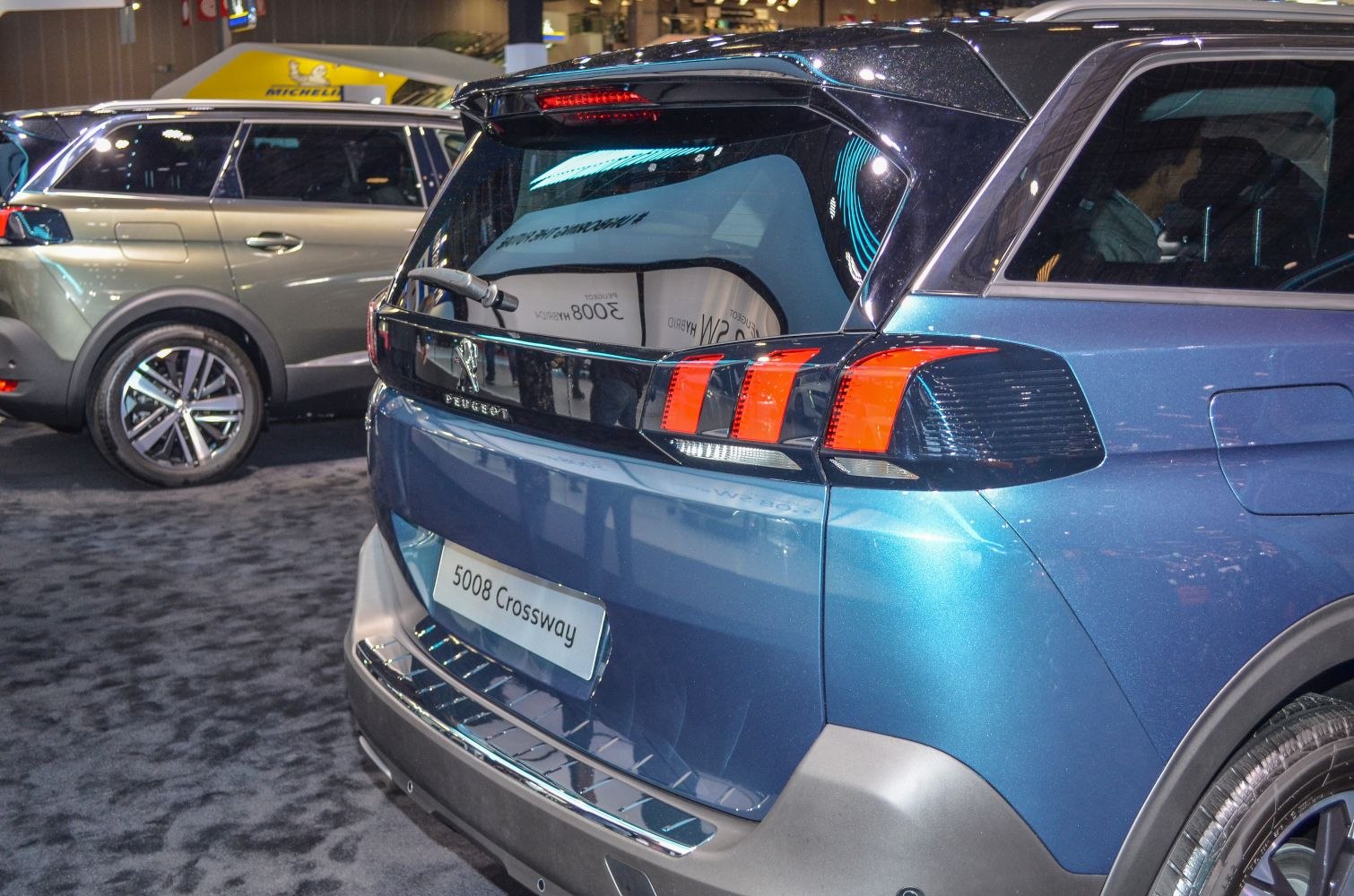 Rear end with distinctive triple LED tail lights and modern rear hatch design