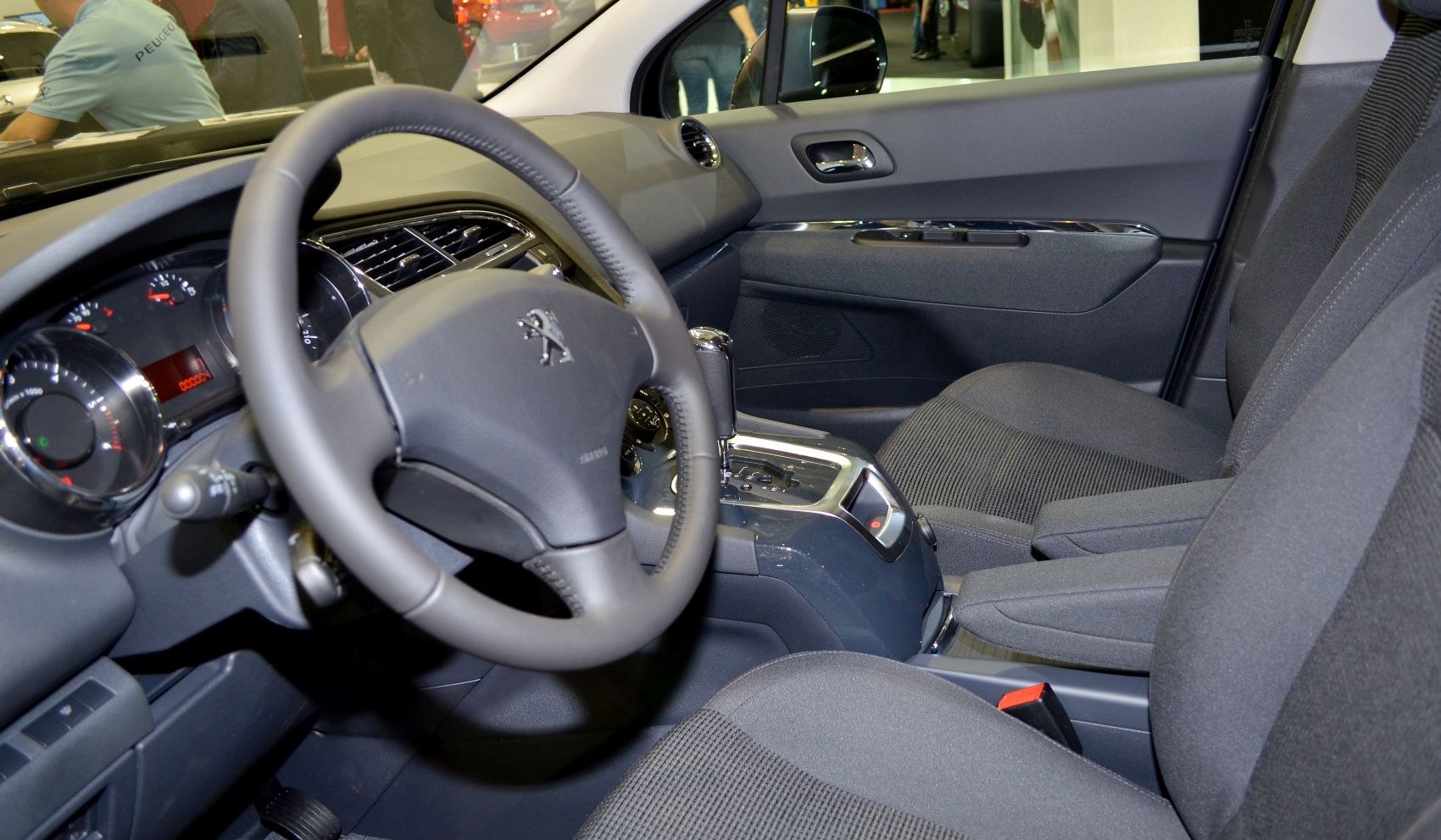 Dashboard, steering wheel, and front seats interior view