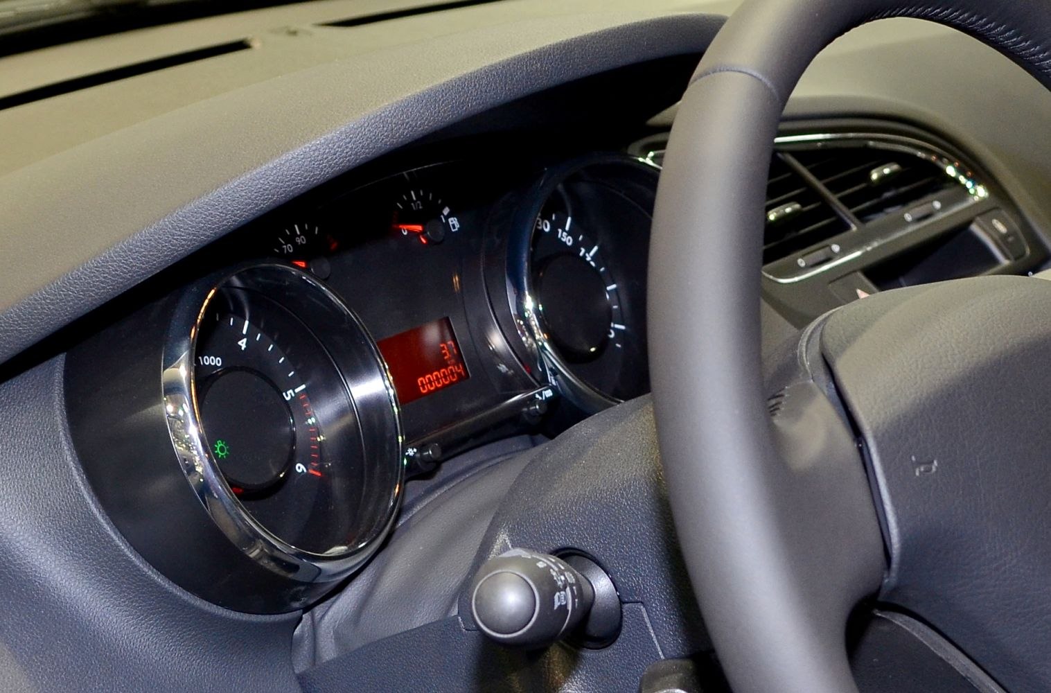 Dashboard instrument cluster and steering wheel close-up