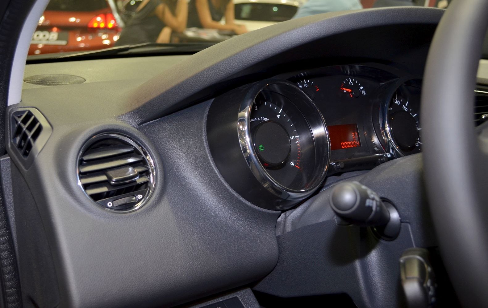 Close-up of dashboard with instrumental cluster and air vent