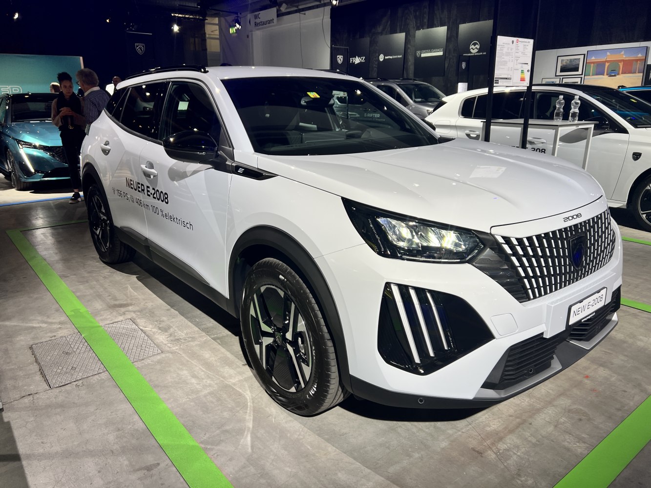 Electric SUV with LED headlights and detailed front grille.