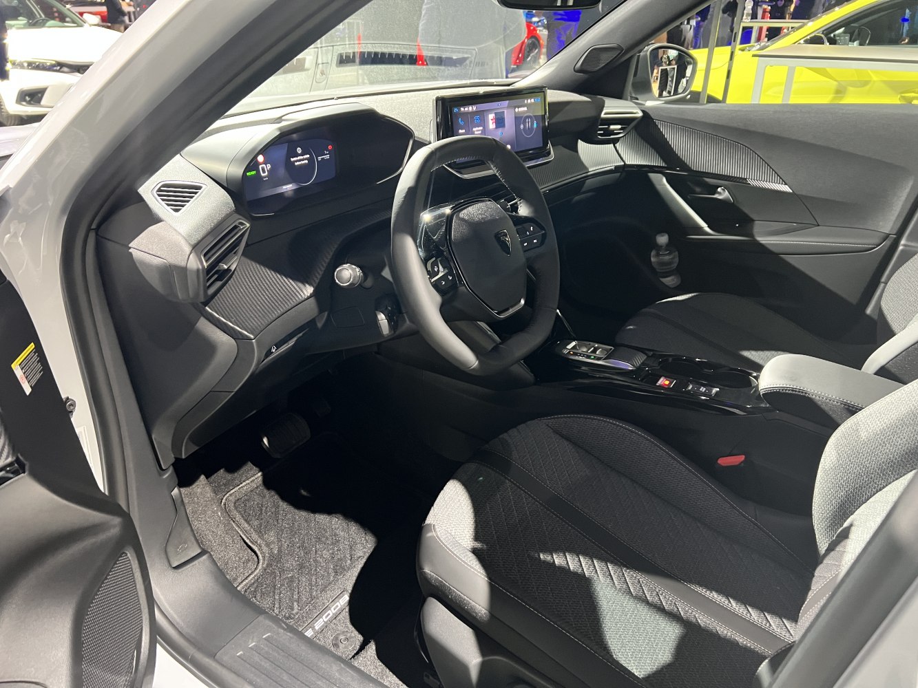 Digital instrument cluster and touchscreen infotainment inside a modern car interior