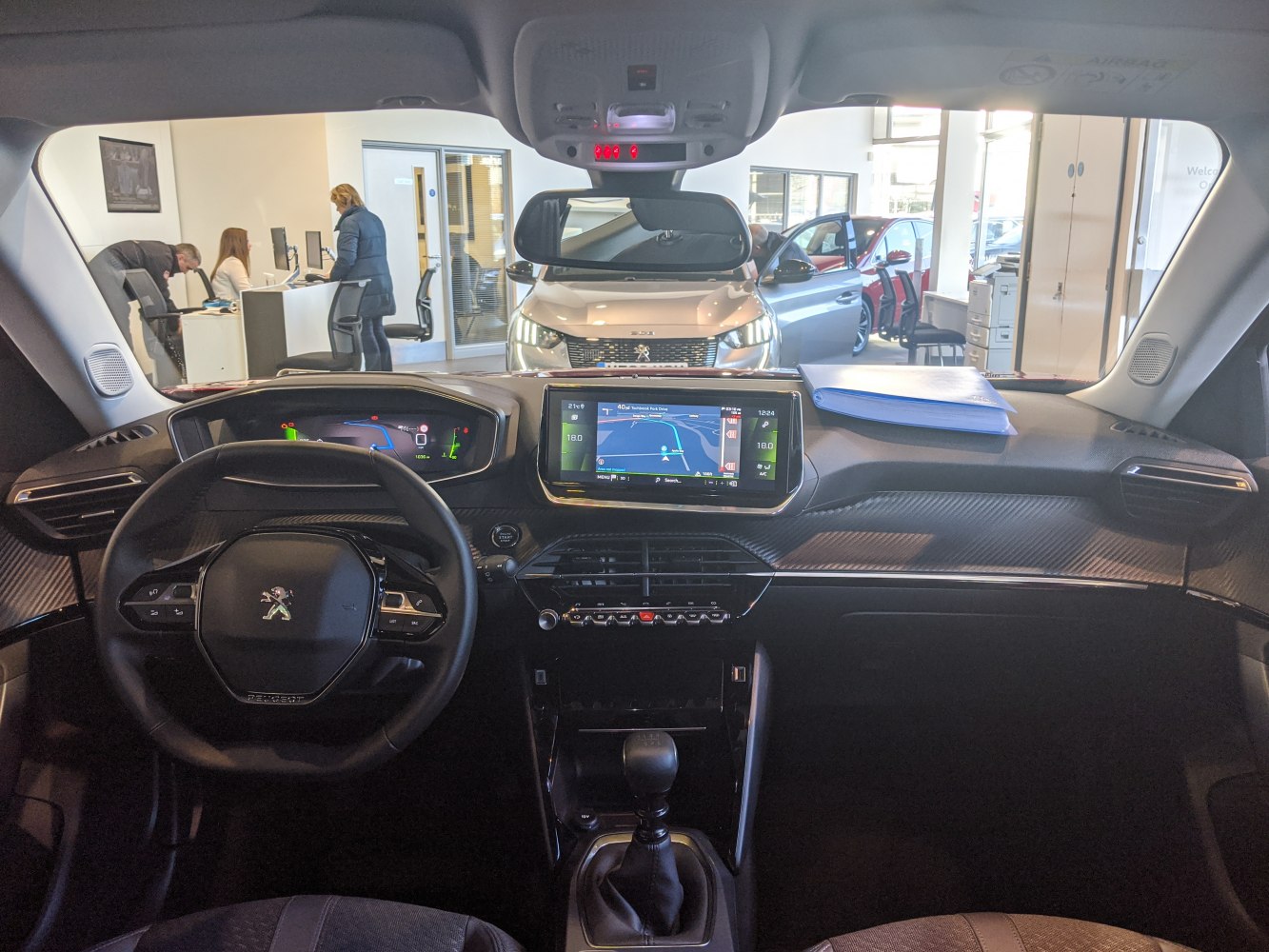 Digital instrument cluster and central touchscreen navigation on Peugeot 2008 II interior