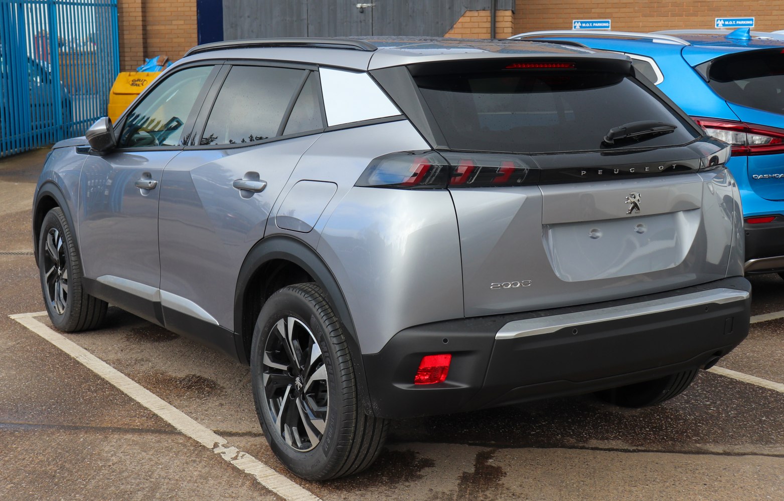 Rear and side profile view of a modern SUV with distinctive tail lights and alloy wheels.