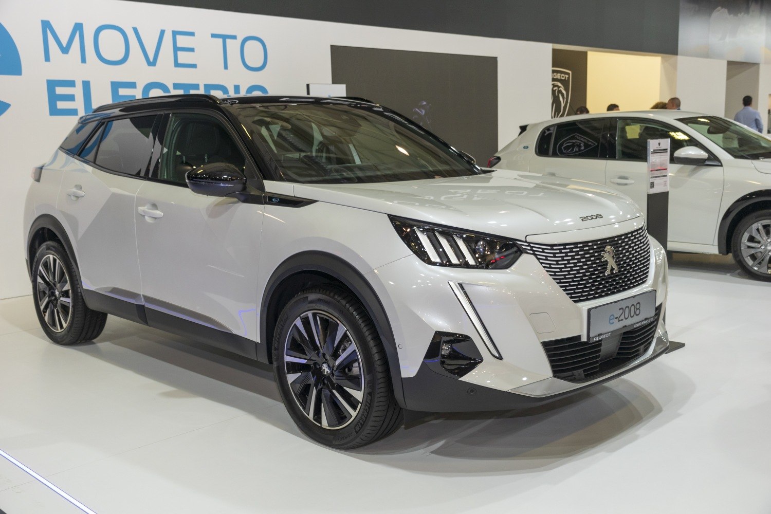 Front-side view of electric SUV with modern headlights and alloy wheels