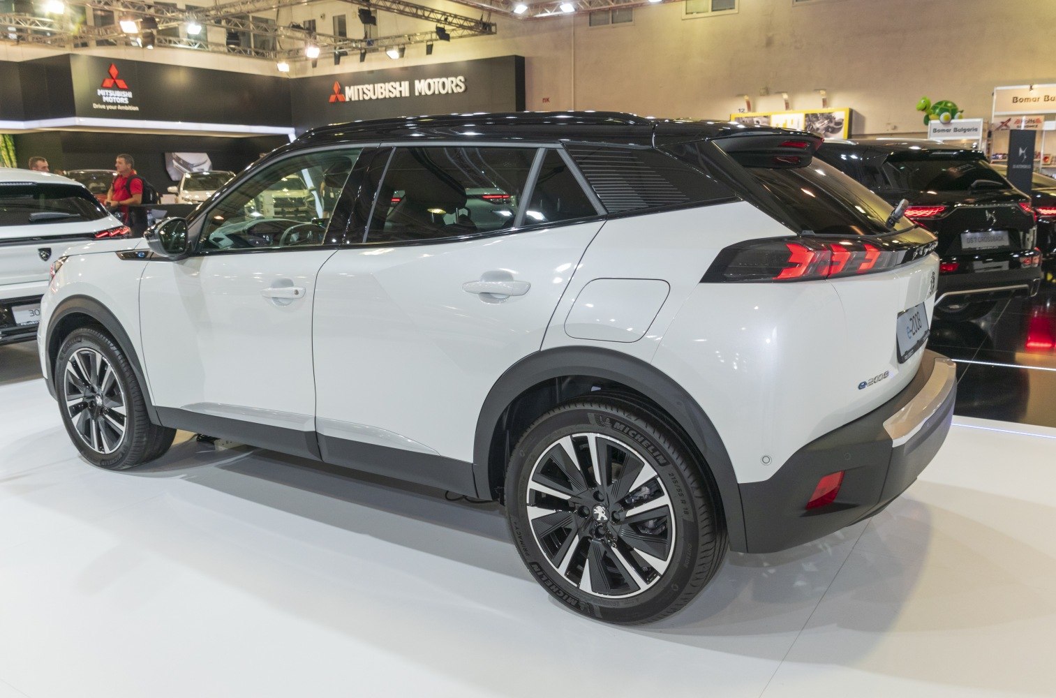 Side and rear view showing distinctive taillights and alloy wheels