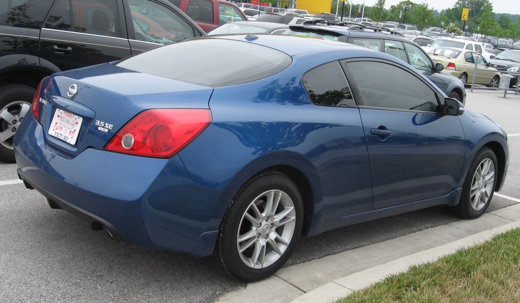 Two-door coupe with distinctive rear design and alloy wheels